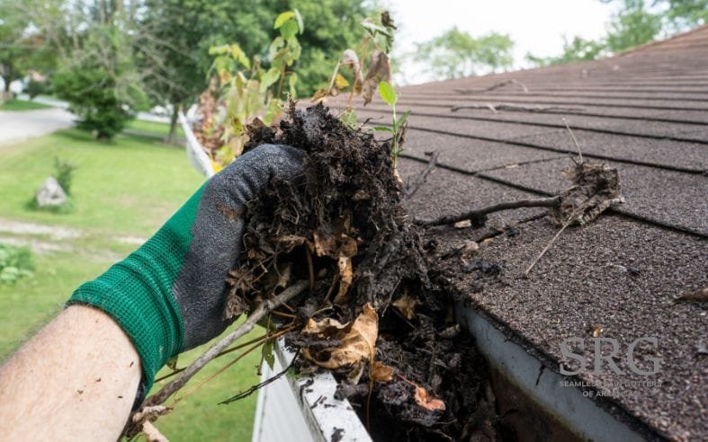 person getting gutters cleaned in Little Rock Arkansas