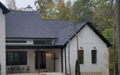 beautiful white house with new rain gutter installation