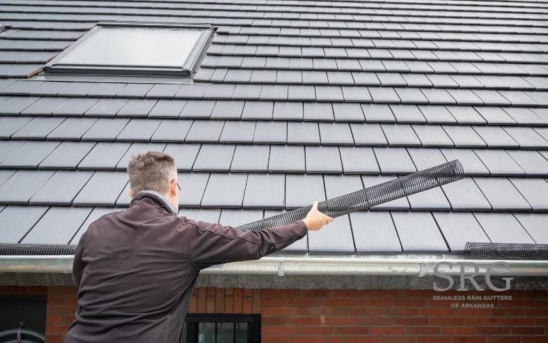 professional doing a new rain gutter guard installation