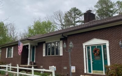 Red brick house with new rain gutter installation near Little Rock