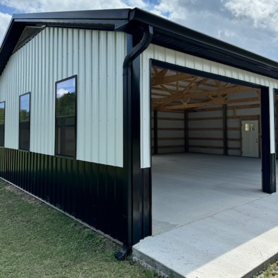 new black and white colored garage with newly installed rain gutter